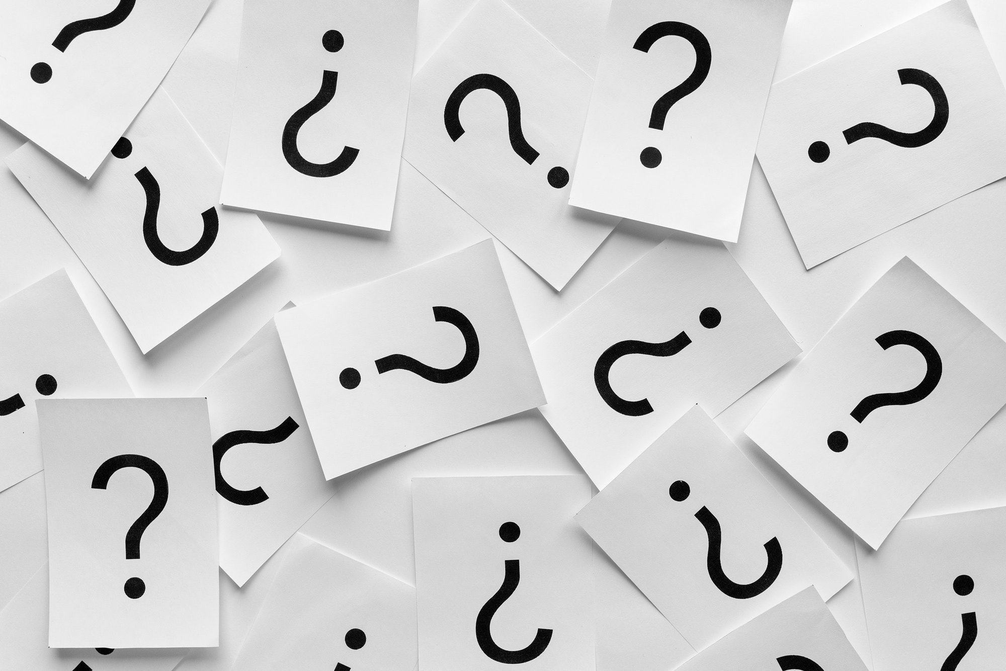 Background texture of printed question marks