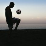 Man playing soccer.