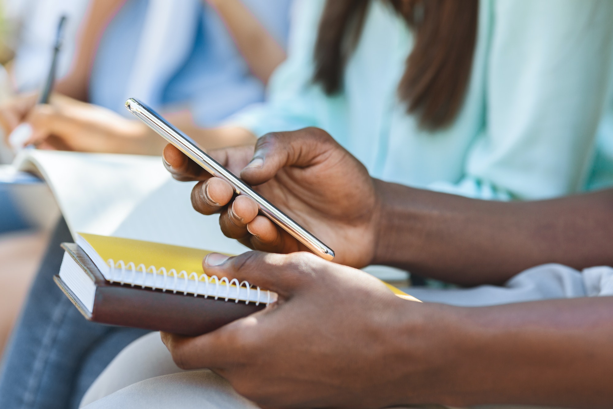 Online Education App. Smartphone In Hands Of Unrecognizable African Male Student