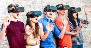 Surprised friends exploring metaverse on vr glasses