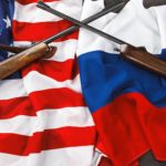 Usa flag and Russia flag background with two crossed shotguns