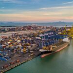 Aerial top view container cargo ship in import export business commercial trade logistic.
