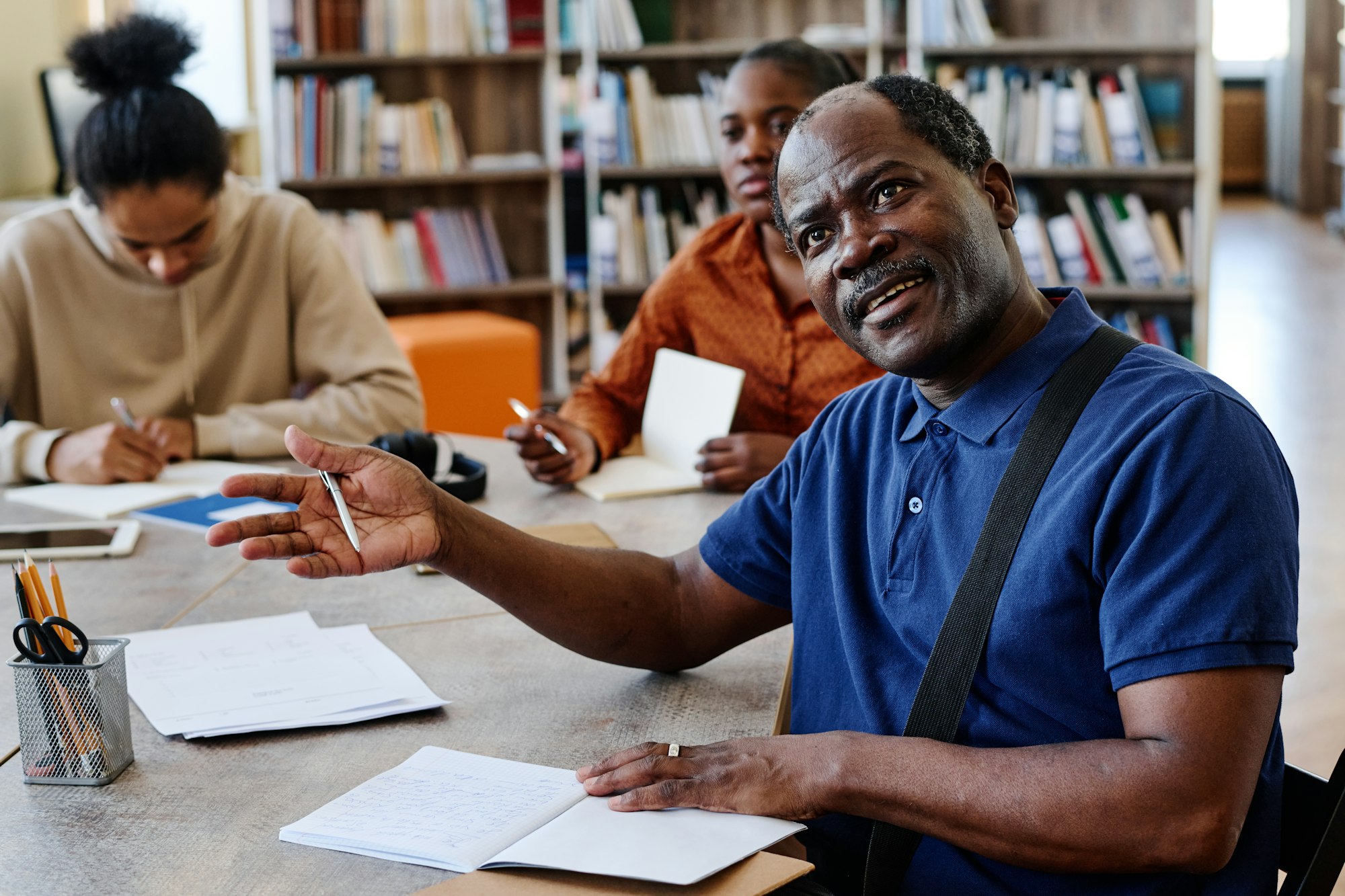 Mature Man Talking To Teacher