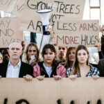 Big organized group of diverse people demonstrating in favor of world peace.