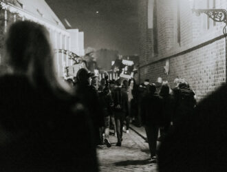 A protest scene depicting the collective spirit of social movements, emphasizing the struggle for change and equality.