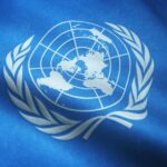 Closeup shot of the waving flag of the United Nations with interesting textures