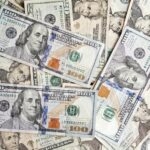 us dollar banknotes stack and pile background